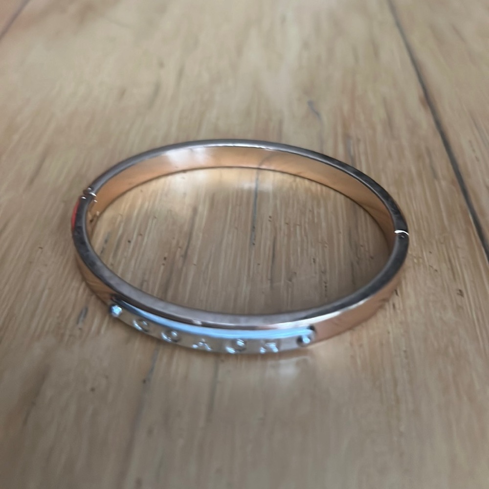 Rose gold and silver Coach bangle